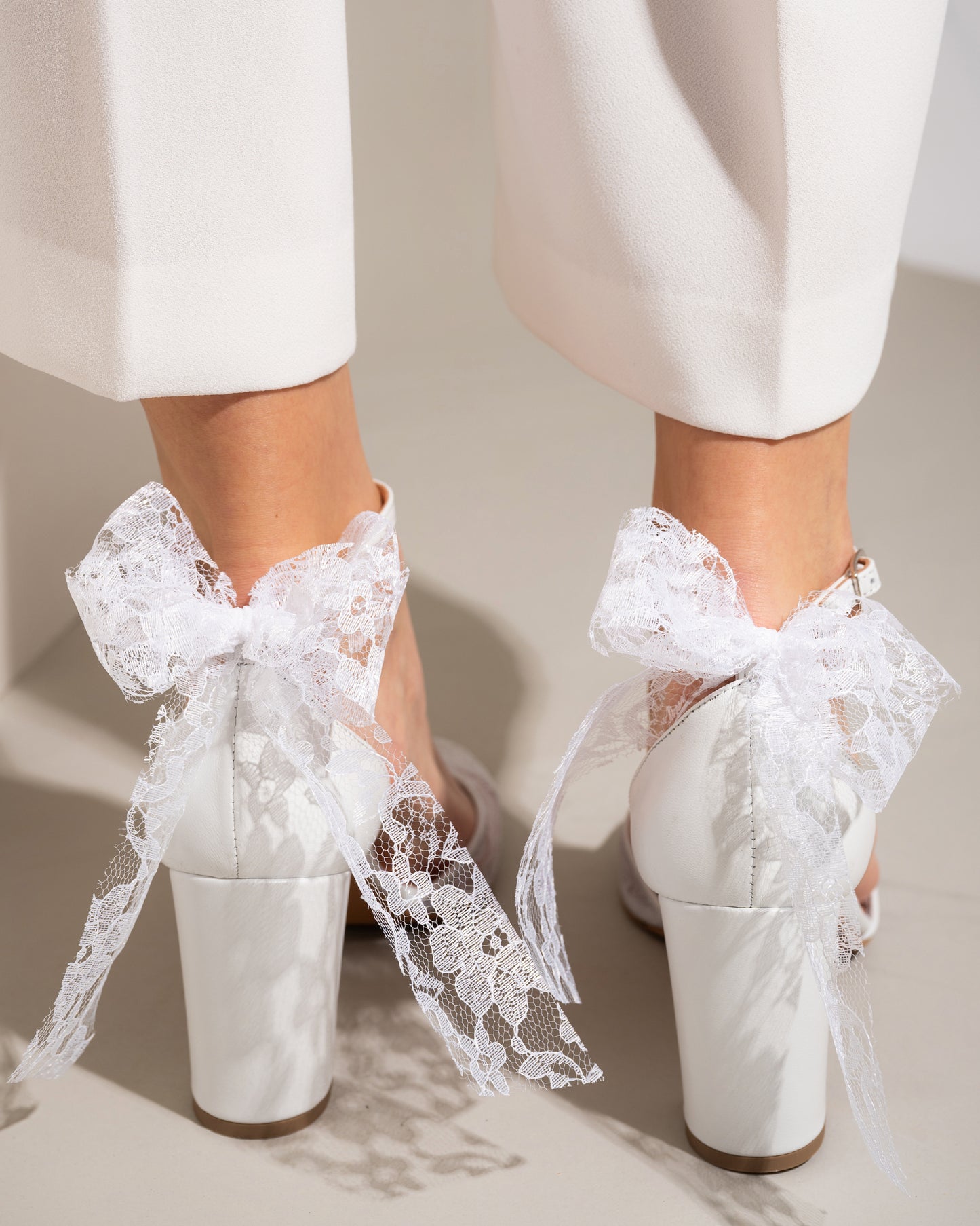 wedding shoes with lave bow in the back
