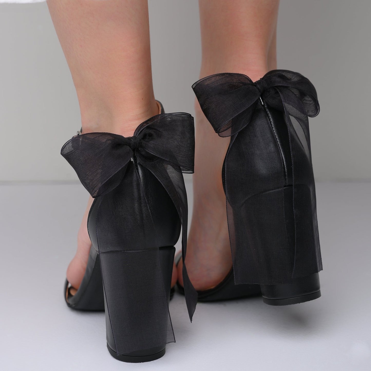 size 12 women shoes, black heels with a bow on the front
