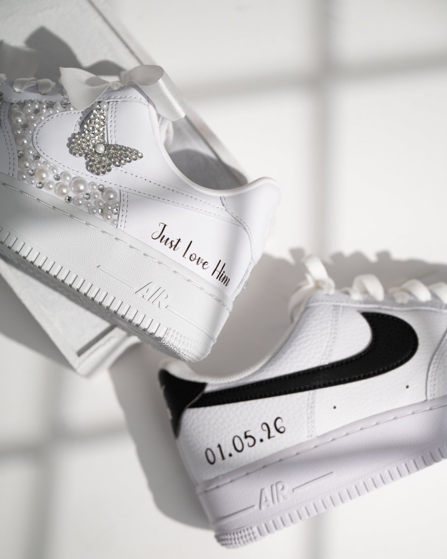 White sneakers with decorative elements on a light background